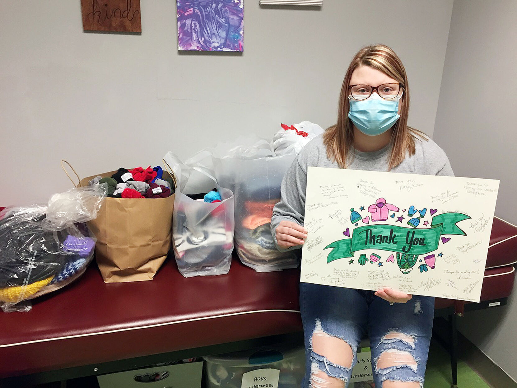 Community members donate hats and gloves to students